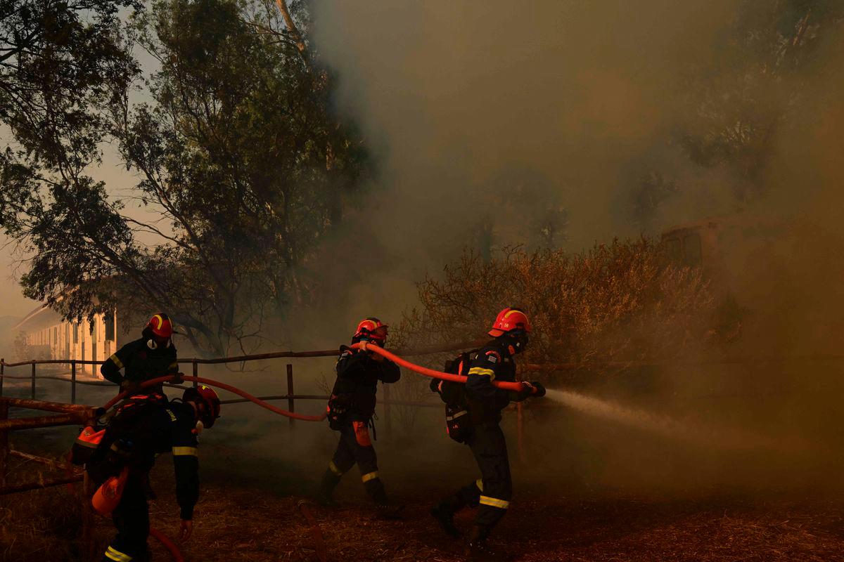Firemen work to extinguish a wildfire in Palaia Fokaia. AFPPix