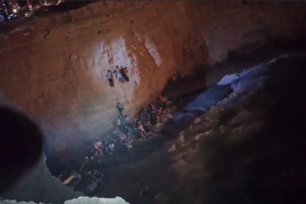 This screen grab from a video made available on October 6, 2022 by the Hellenic Coast Guard, shows the rescue of migrants from a shipwreck off the island of Cythera, south of the Peloponnese peninsula. Greece’s coastguard reports it has recovered the bodies of 15 people in two separate migrant boat sinkings, with several more feared missing. There was no official toll yet from a second sinking south of the Peloponnese peninsula. AFPPIX