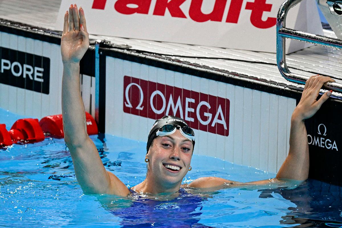 US' swimmer Gretchen Walsh celebrates after winning the final of the women's 100m butterfly swimming event during the 2025 World Aquatics Championships in Singapore on July 28, 2025. - Oli SCARFF / AFP
