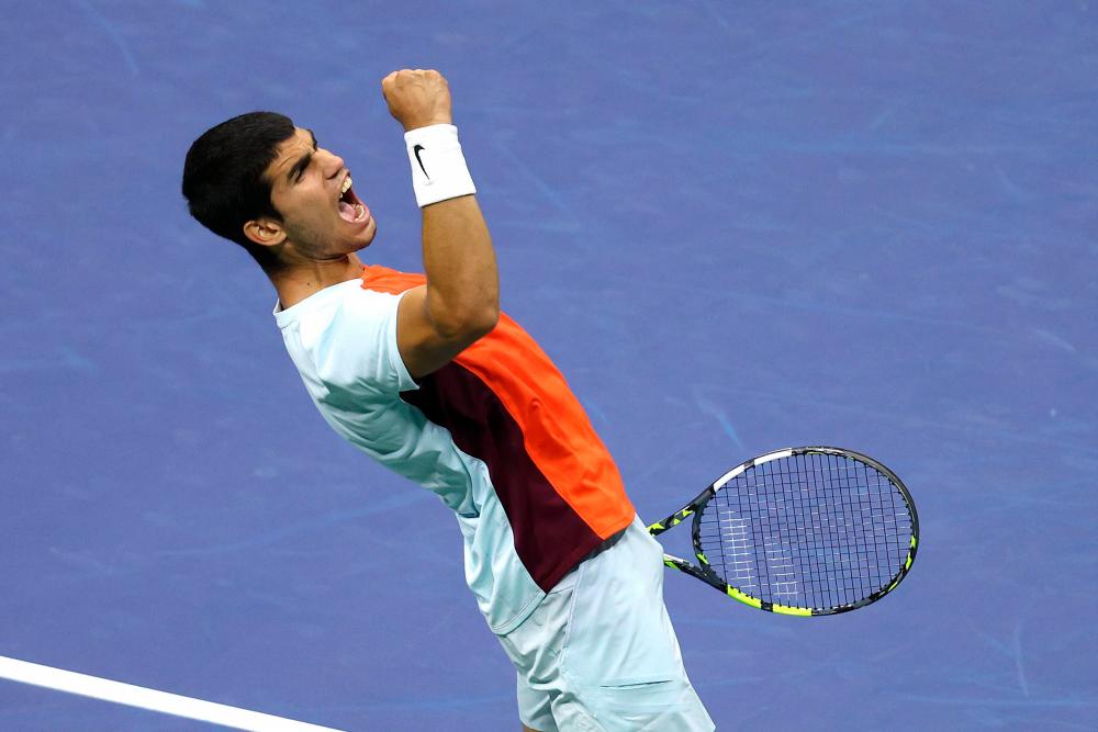 NEW YORK, NEW YORK - SEPTEMBER 07: Carlos Alcaraz of Spain celebrates match point against Jannik Sinner of Italy during their Men’s Singles Quarterfinal match on Day Ten of the 2022 US Open at USTA Billie Jean King National Tennis Center on September 07, 2022 in the Flushing neighborhood of the Queens borough of New York City. AFPPIX