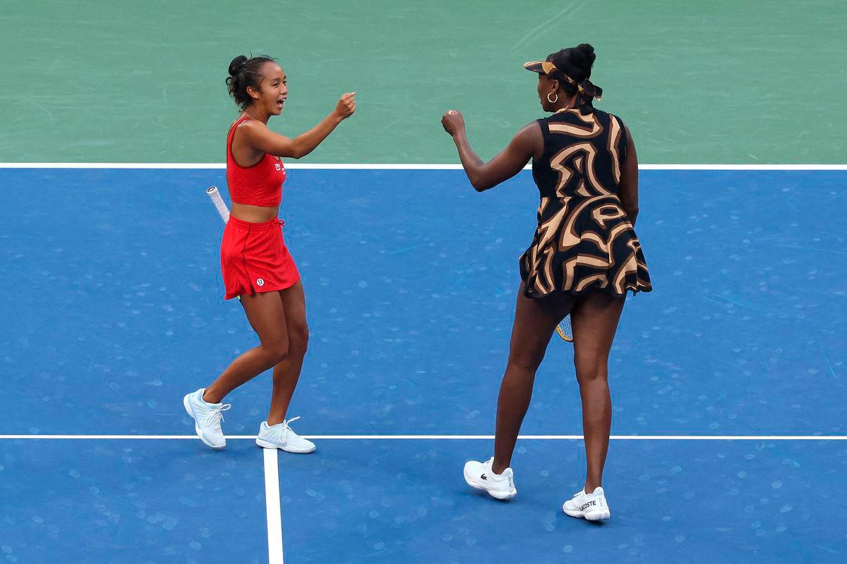 Leylah Fernandez of Canada (L) and partner Venus Williams of the United States fist bump during their Women’s Doubles Third Round match against Shuai Zhang of China and Ekaterina Alexandrova on Day Nine of the 2025 US Open at USTA Billie Jean King National Tennis Center on September 1, 2025 in the Flushing neighborhood of the Queens borough of New York City. Matthew Stockman/Getty Images/AFP