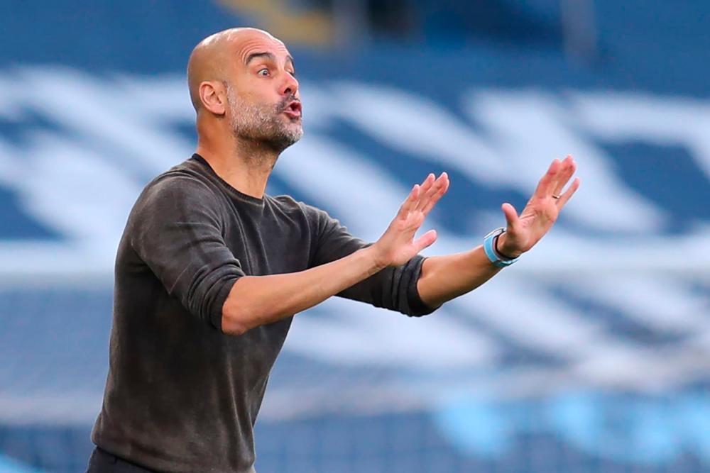 Guardiola calls for Man City cool heads to see off PSG