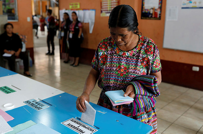 A woman votes at a polling station during the first round of Guatemala’s presidential election, in San Pedro Sacatepequez, Guatemala, June 16, 2019. — AFP