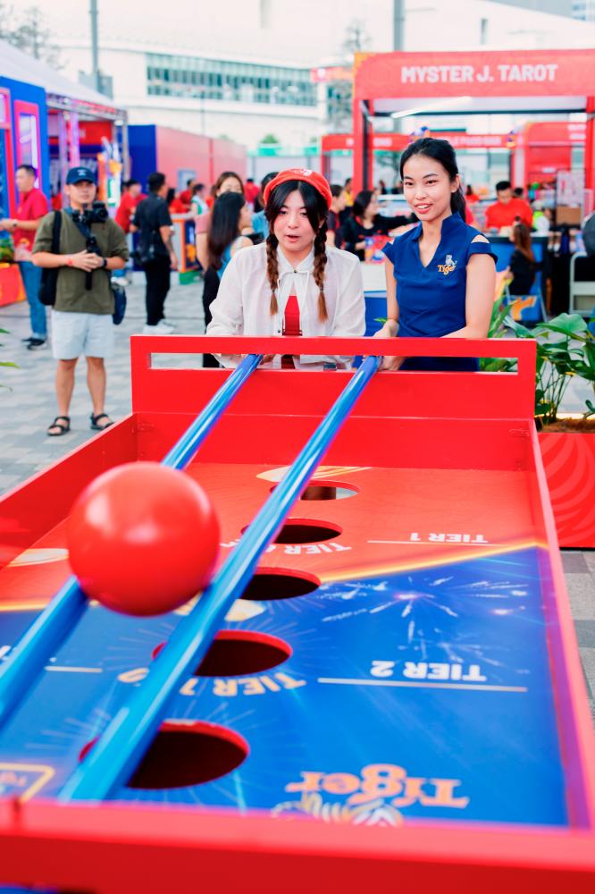 $!Visitors having a go at the games in Tiger Town.