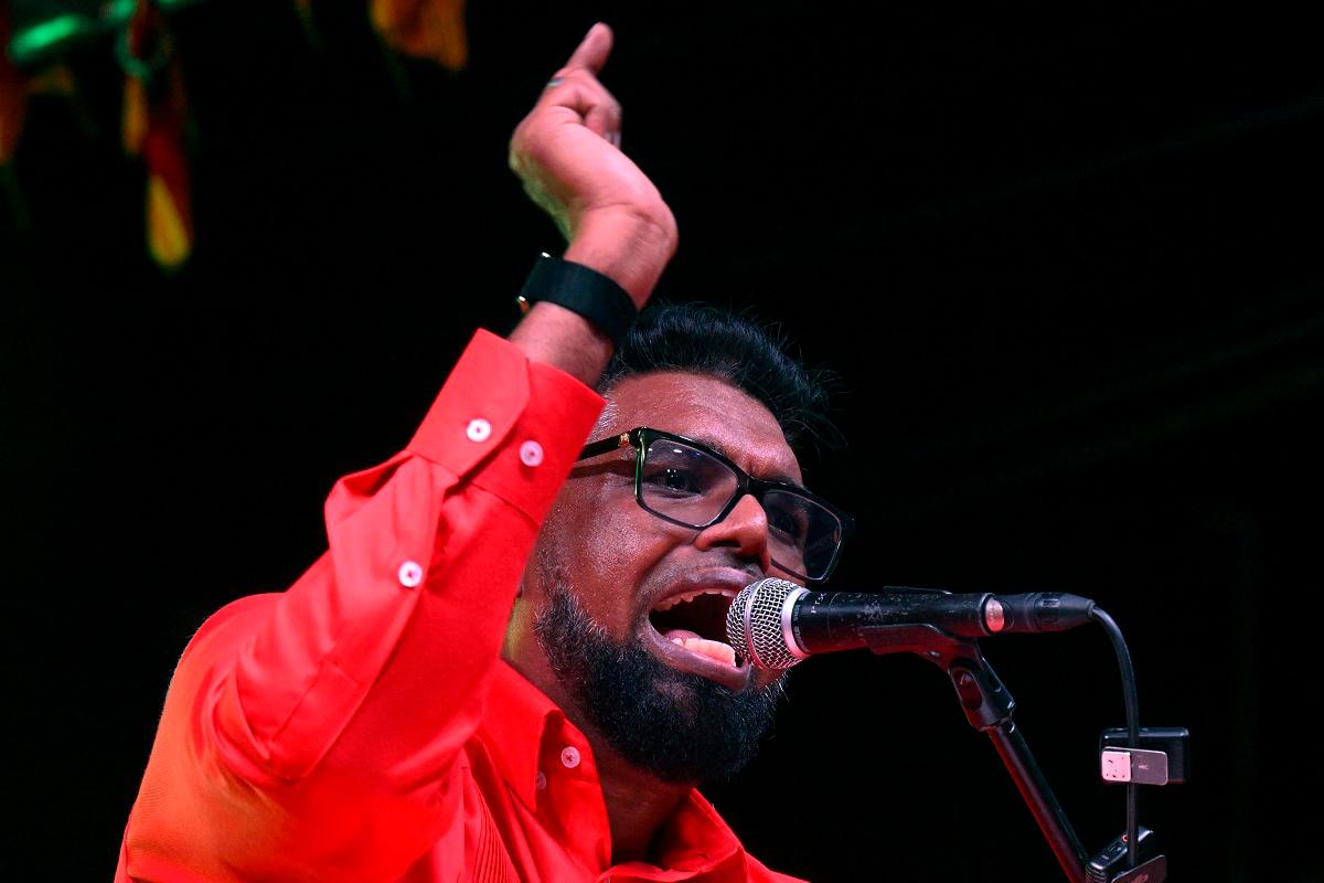 Guyana’s President and presidential candidate for re-election Mohamed Irfaan Ali delivers a speech at a rally in Georgetown, on August 26, 2025. Guyana will hold presidential elections next September 1st. - Joaquin Sarmiento / AFP