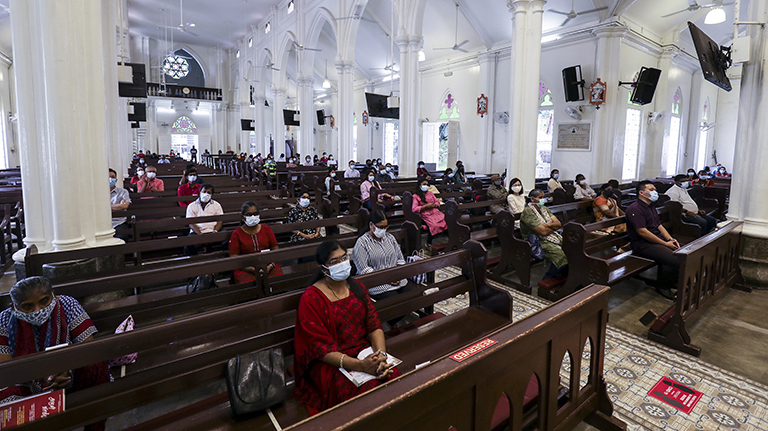 $!Back to Church ... Members of St Anthony’s Church Pudu, Kuala Lumpur, sit apart to maintain social distancing yesterday during the first mass since March 18 when the movement control order was enforced to curb the spread of Covid-19. – HAFIZ SOHAIMI/THESUN