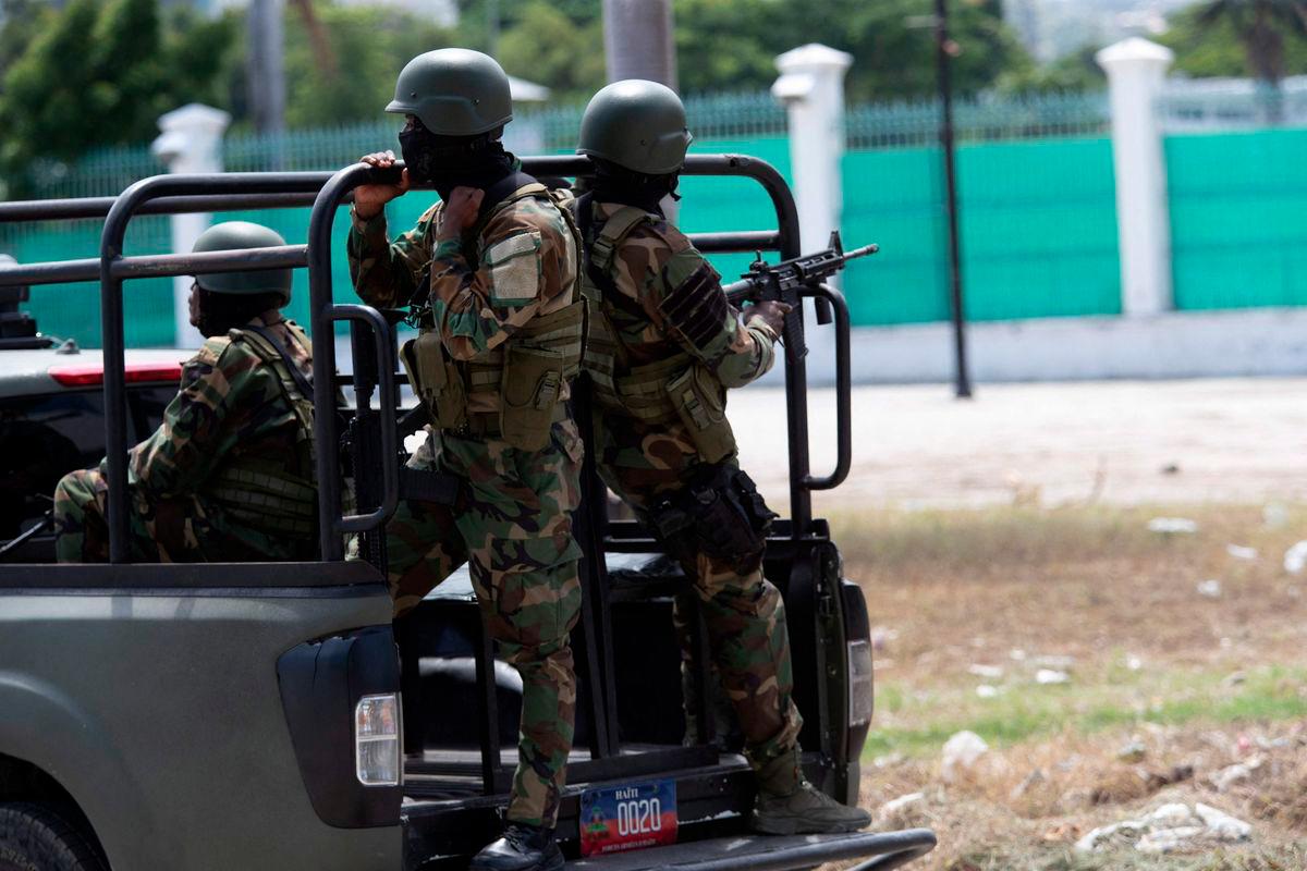 Members of the Haitian armed forces (FADH) patrol the city center near the National Palace in Port-au-Prince on October 1, 2025. (Photo by Clarens SIFFROY / AFP)