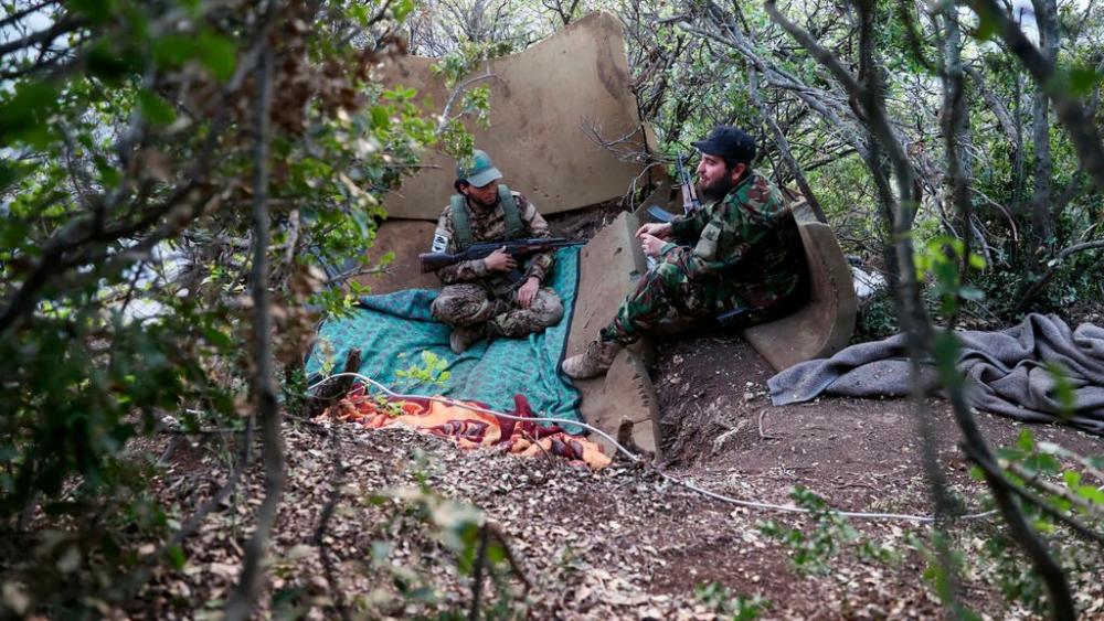 File photo: Fighters affiliated with the Hayat Tahrir al-Sham (HTS) jihadist group take a position in the mountainous northern countryside of Syria’s northwestern Latakia province on April 23, 2022. AFPpix