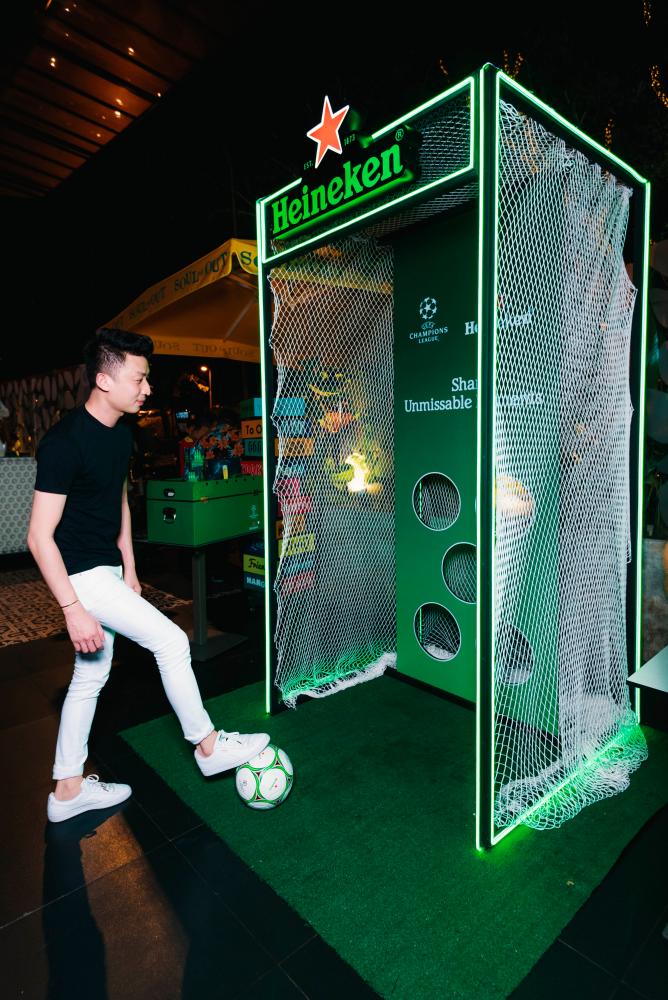 A football fan putting his skills to the test at the Heineken Extra Time Zone.