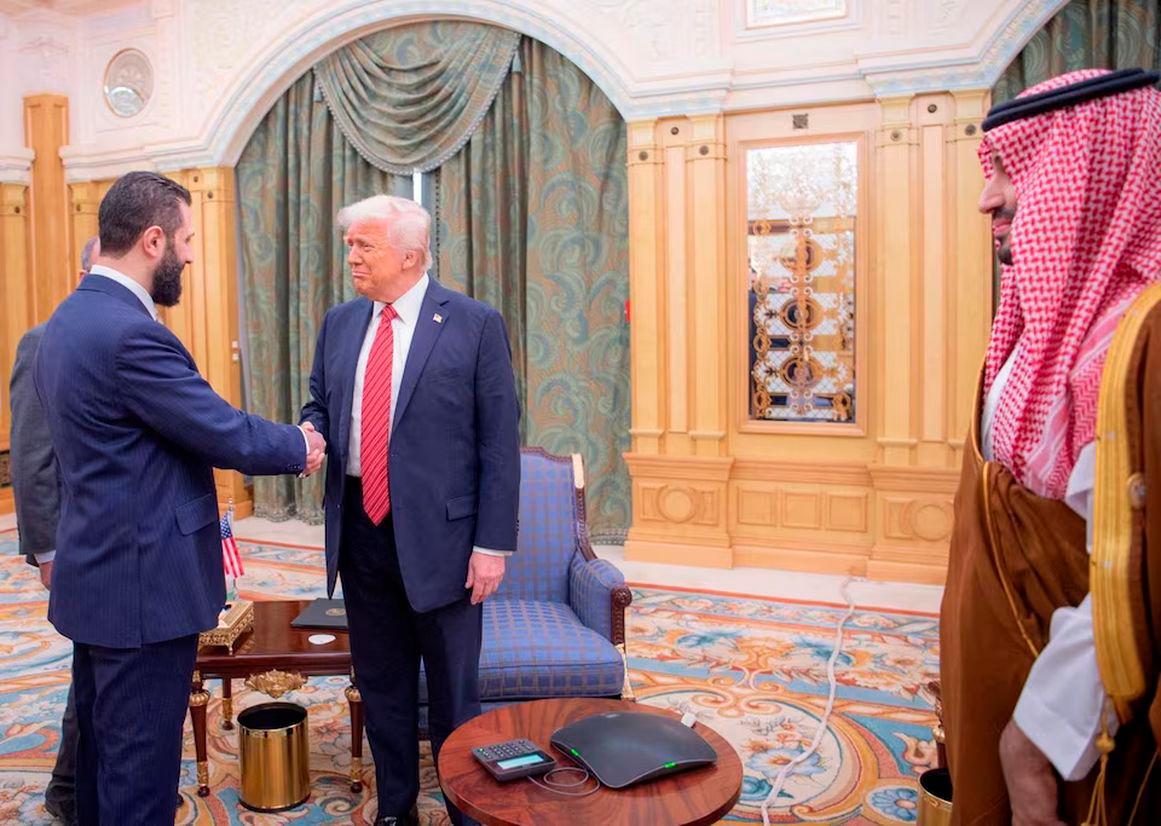 U.S. President Donald Trump meets with Syrian President Ahmed al-Sharaa in Riyadh, Saudi Arabia, in this handout released on May 14, 2025. Saudi Press Agency/Handout via REUTERS