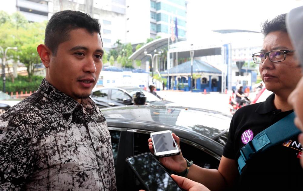 Economic Affairs Minister’s political secretary, Hilman Idham, responds to media queries after being called to give evidence today regarding the dissemination of a pornographic video linking Datuk Seri Mohamed Azmin Ali with a man at the Bukit Aman police headquarters.