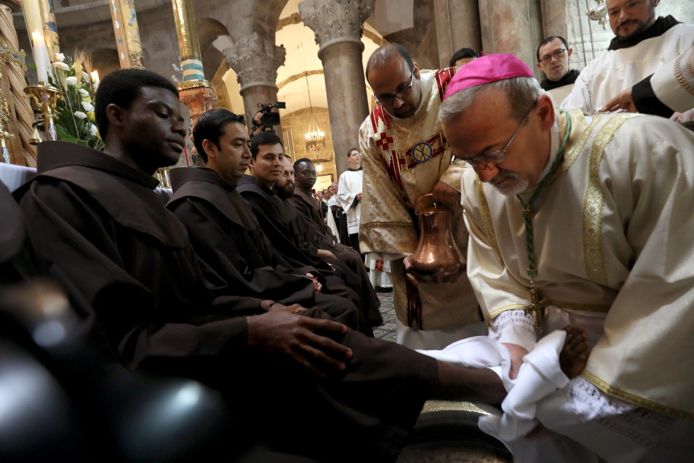 The head of the Roman Catholic Church in the Holy Land, Apostolic Administrator of the Latin Patriarchate Pierbattista Pizaballa conducts the traditional Washing of the Feet ceremony during the Holy Thursday (Maundy Thursday) Easter procession at the Church of the Holy Sepulchre in Jerusalem’s Old City April 18, 2019 traditionally believed to be the site of Christ’s crucifixion and resurrection. — AFP