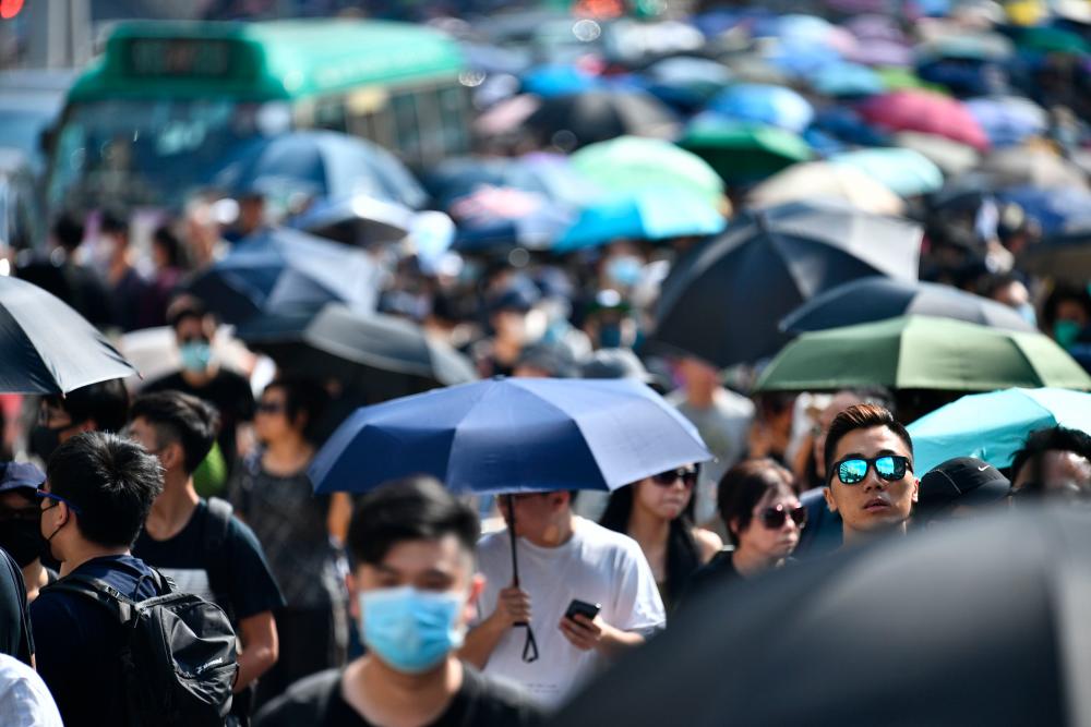 People take part in a pro-democracy march near the West Kowloon Terminus in Hong Kong on October 20, 2019. - AFP