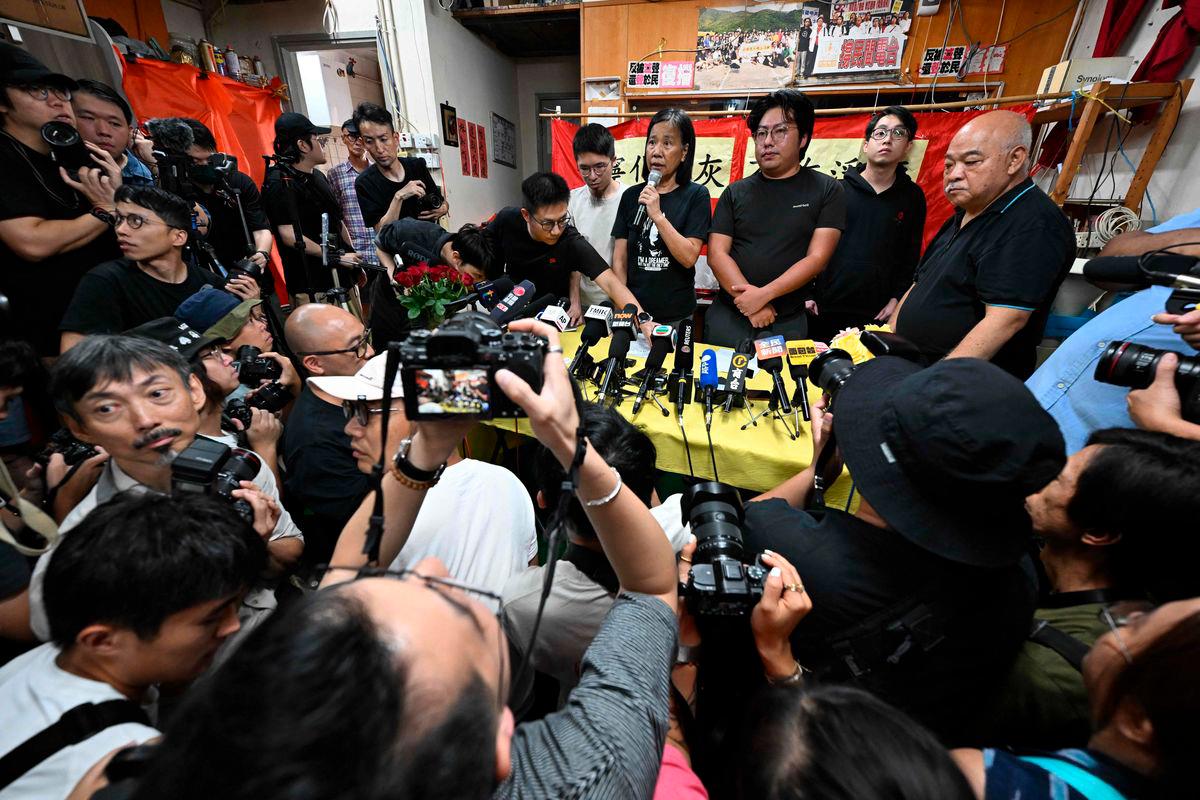 League of Social Democrats leader Chan Po-ying (C) speaks at a press conference at their headquarters in Hong Kong on June 29, 2025. (Photo by Peter PARKS / AFP)