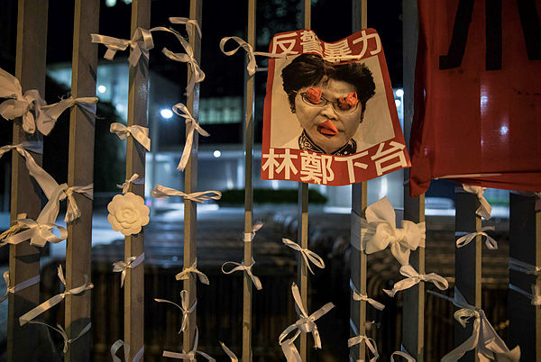 A poster bearing an image of Hong Kong Chief Executive Carrie Lam is displayed outside the government headquarters on June 17, 2019.