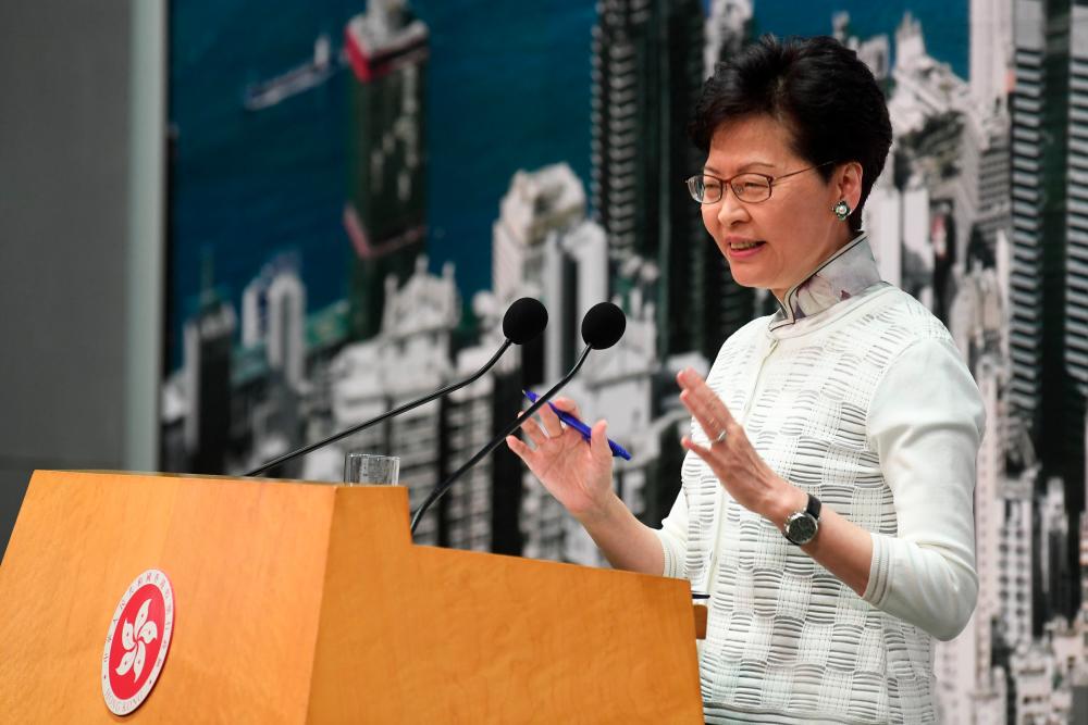 Hong Kong Chief Executive Carrie Lam speaks during a press conference at the government headquarters in Hong Kong on June 15, 2019. — AFP
