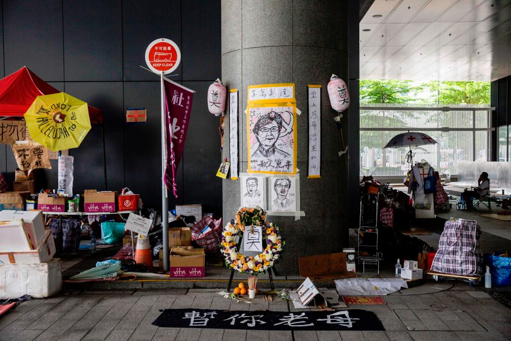 A shrine for Hong Kong Chief Executive Carrie Lam set up by protesters opposed to a China extradition law outside the government headquarters in Hong Kong. — AFP
