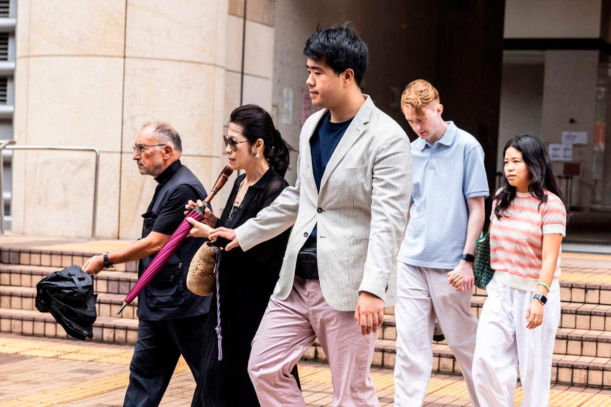 Jimmy Lai’s wife Teresa Lai (2nd L) and their son Lai Shun Yan (R) leave the West Kowloon court where Lai’s national security trial is being held in Hong Kong on August 15, 2025. AFPPix
