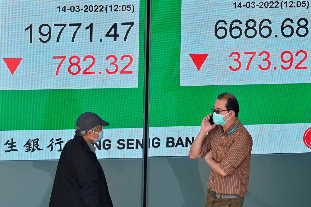 An electronic board showing the numbers for the Hang Seng Index in Hong Kong yesterday. – AFPpix