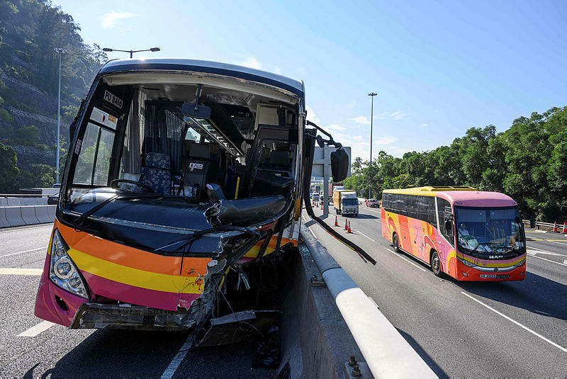 The damaged coach after it collided with a taxi in Hong Kong on Nov 30, 2018. — AFP