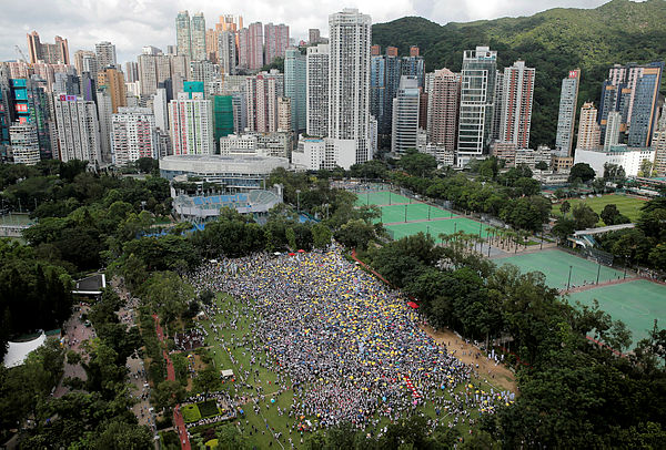 Demonstrators hold yellow umbrellas, the symbol of the Occupy Central movement, during a protest to demand authorities scrap a proposed extradition bill with China, in Hong Kong, China June 9, 2019.