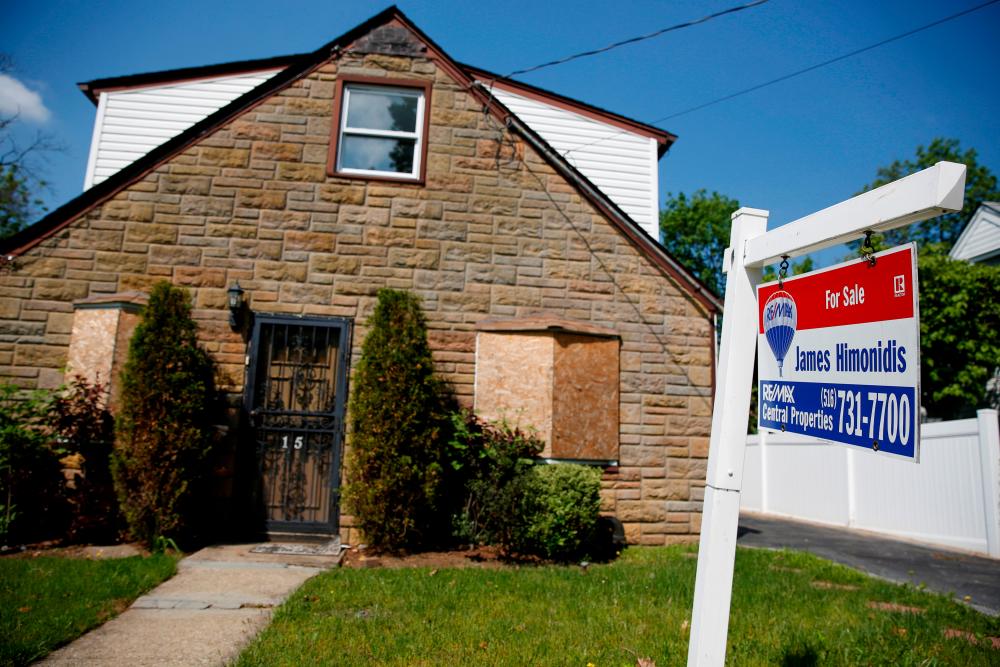 File picture shows a sign outside a single family house in Garden City, New York. A report from the Mortgage Bankers Association shows applications for loans to purchase a home increased 3% last week from the prior period. – REUTERSPIX
