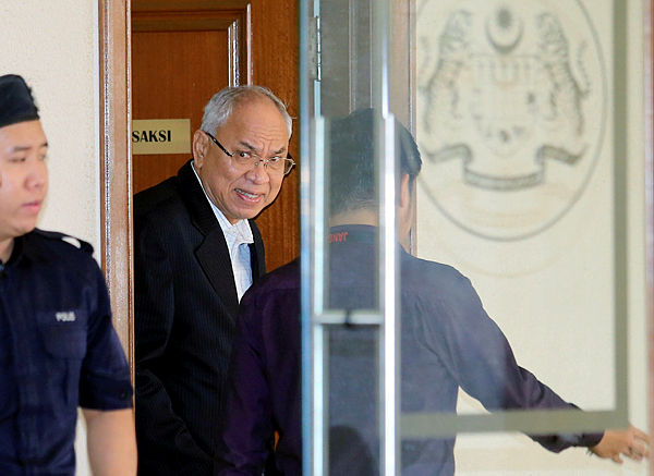 Former non-executive director of SRC International Sdn Bhd, Datuk Suboh Md Yassin exiting the witness room at the High Court in Kuala Lumpur today.
