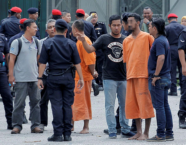Several suspects arrested in connection with the incident were brought to the scene at the Sri Maha Mariamman Temple at USJ 25, Subang Jaya on Dec 3, 2018. — BBXpress