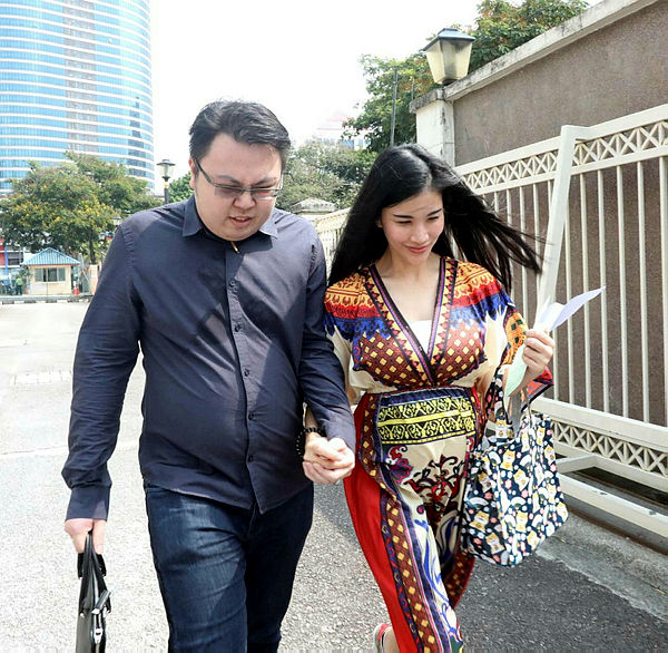 Miss Sirirat Pichetwanich, 33, was accompanied by her husband after being fined RM7,000 by the Petaling Jaya sessions court for uploading a nude photo of her friend on Facebook. — BBXpress