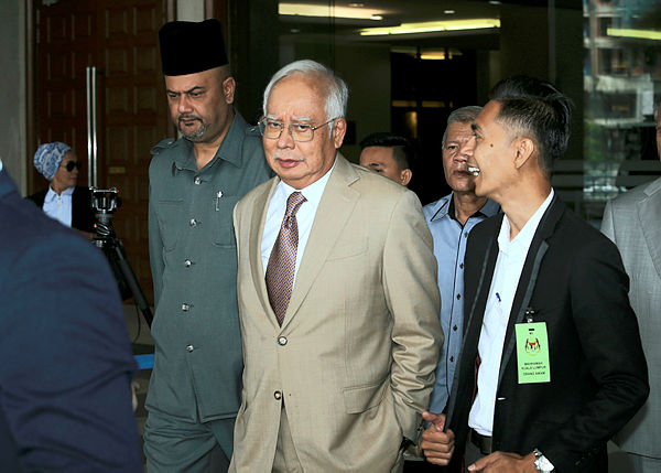 Former prime minister Datuk Seri Najib Abdul Razak leaves the court during a trial break at the Kuala Lumpur High Court on April 17, 2019. — Bernama