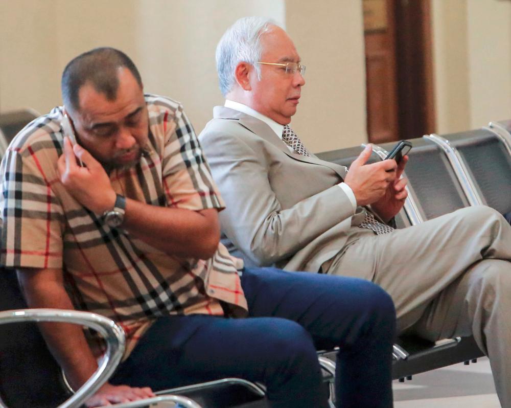 Former prime minister Datuk Seri Najib Abdul Razak (R) at the Kuala Lumpur High Court, on May 7, 2019. — BBX