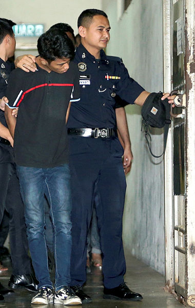 Mohamad Farreyl Haikal Abdullah, 22, was charged in the Petaling Jaya Magistrate’s Court today for the murder of an auxiliary policewoman at an apartment in Damansara Damai last week. — BBXpress