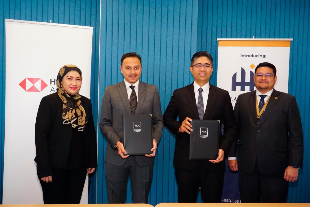 (From left): HSBC Amanah commercial banking head Dafinah Helmi, Raja Amir Shah, Hairol Ariffein and HDC’s Halal Integrated Platform head Mohammad Hafiz Jamaluddin at the MoU signing ceremony on Sept 21.