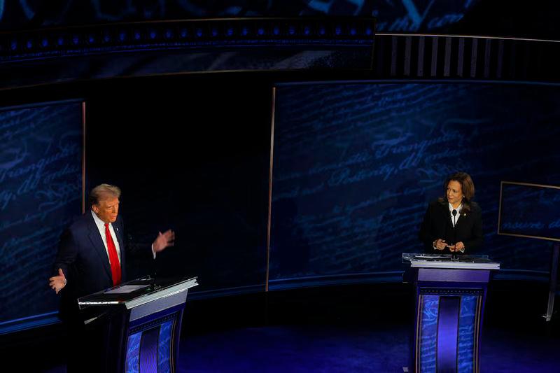 Republican presidential nominee, former U.S. President Donald Trump speaks as Democratic presidential nominee, U.S. Vice President Kamala Harris listens as they attend a presidential debate hosted by ABC in Philadelphia - REUTERSpix