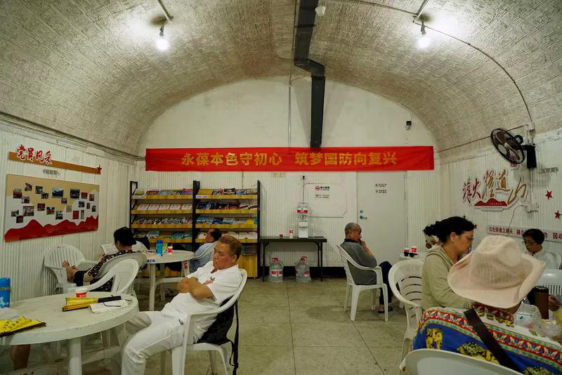 People cool off in an air raid shelter amid a red alert for heatwave in Hangzhou, Zhejiang province - REUTERSpix