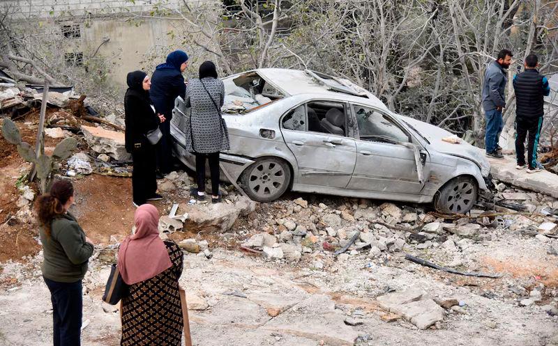 People gather at the site of an Israeli airstrike on the northern Lebanese town of Ain Yaaqoub - REUTERSpix