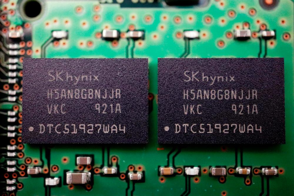 Memory chips by SK Hynix are seen on a circuit board of a computer in this illustration picture. – Reuterspic
