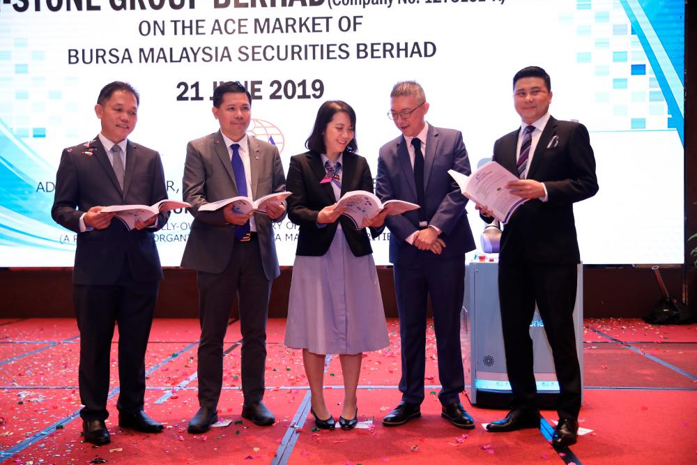 From left: i-Stone Group Bhd executive directors Chin Chung Lek and Chan Kok San, Tee, M&amp;A Securities Sdn Bhd head of corporate finance Gary Ting Hua Tai and managing director of corporate finance Datuk Bill Tan at the prospectus launch.