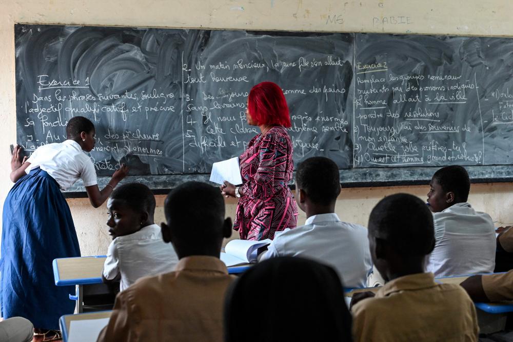 Students are seen at the Djedji Amondji Pierre high school in Adjame, Abidjan, on September 16, 2022. - AFPPIX