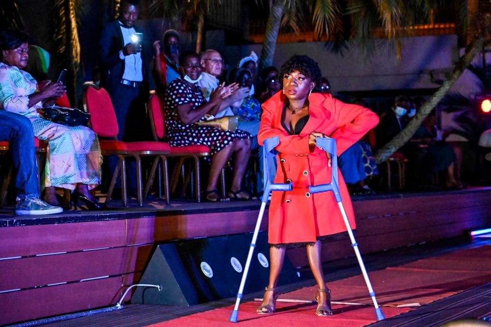 A woman walks down the catwalk during a fashion show of the Mougnan foundation (a NGO improving the living conditions and empowering young women with disabilities) as part of the International Day of Persons with Disabilities, in Abidjan, on December 3, 2021. AFPpix