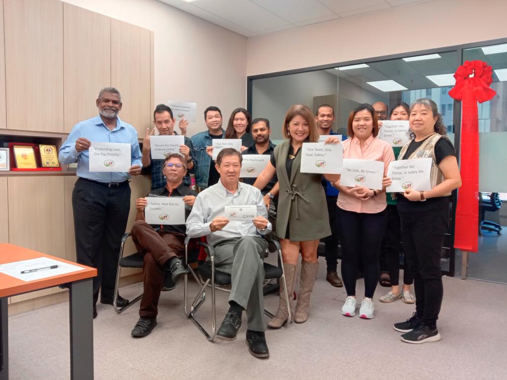 Seated from left, Engku Nasir and Chin Yew Sin, and standing from the right Elize Lee, Ikatan’s Head of comunication with participants at the closing of the 3-day Occupational Safety and Health Coordinator training programme.