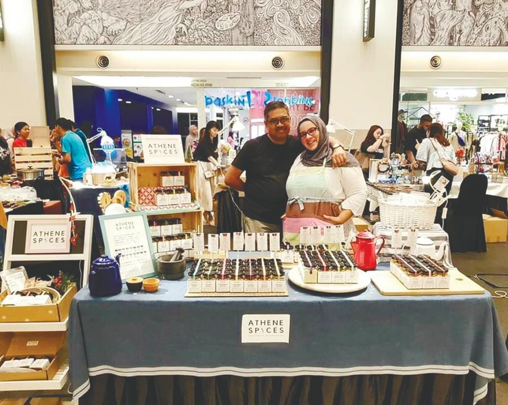 Faten with her husband Azizi at their pop-up store to promote Athene Spices in Publika last year; and (below) with her products. – Courtesy of Faten Rafie