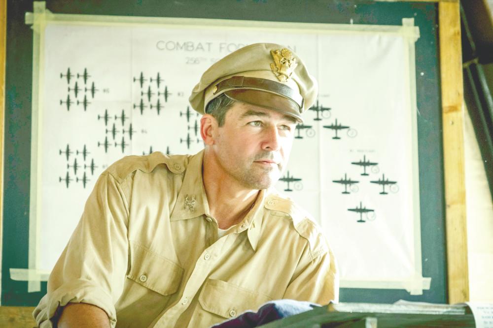 Chandler (below) makes his presence felt as an ambitious, nasty commanding officer in the (from left) mini-series, Catch-22. – HBO Asia