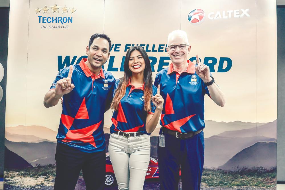 Thumbs up to Caltex with Techron and Clean &amp; Glide Technology (from L) Hans, Chang and Engeler; for powering Chang to a new world record for fastest ascent up Doi Chang mountain in Thailand. — Sunpix by Adib Rawi
