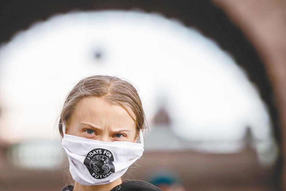 Thunberg takes part in a Fridays For Future protest in front of the Swedish Parliament (Riksdagen) in Stockholm. - AFP-Relaxnews