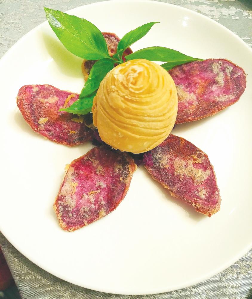 At Elegant Inn Hong Kong Cuisine ... The truffle radish puff with twin purple sweet potatoes. – ALICE YONG