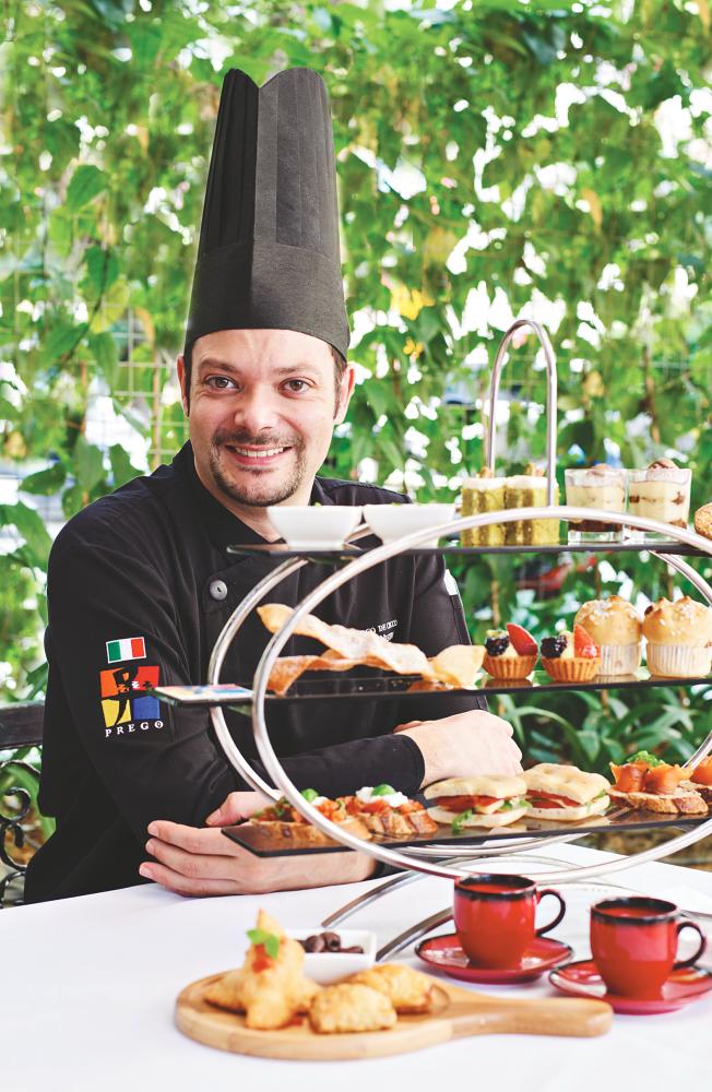 Chef Marco De Cecco with the Italian afternoon tea set.