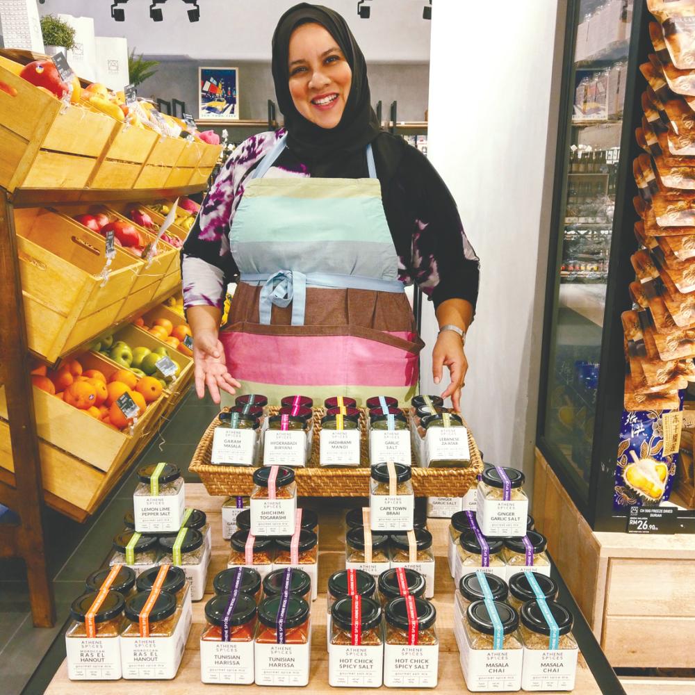 $!Faten at her pop-up store to promote Athene Spices in Publika last year; and (below) with her products. – Courtesy of Faten Rafie