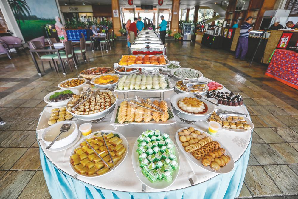 The spread for the Bazar Sajian Muhibah has something for everyone, including sushi. – ASHRAF SHAMSUL/THESUN