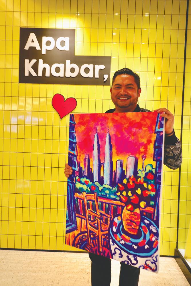 Yazeed with his painting of KLCC that started it all. – ZAHID IZZANI/THESUN